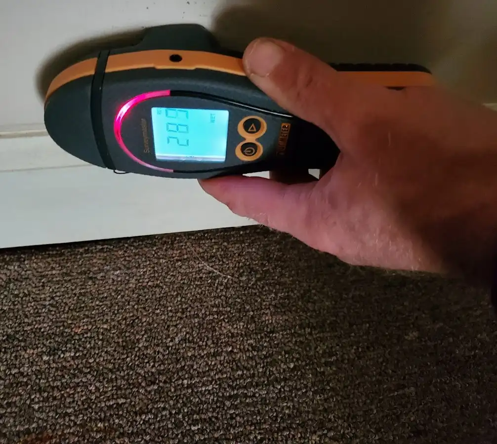 Moisture detection at baseboard during Storm Damage Restoration in Panama City Beach